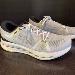On Running Light Gray and Yellow Athletic Shoes